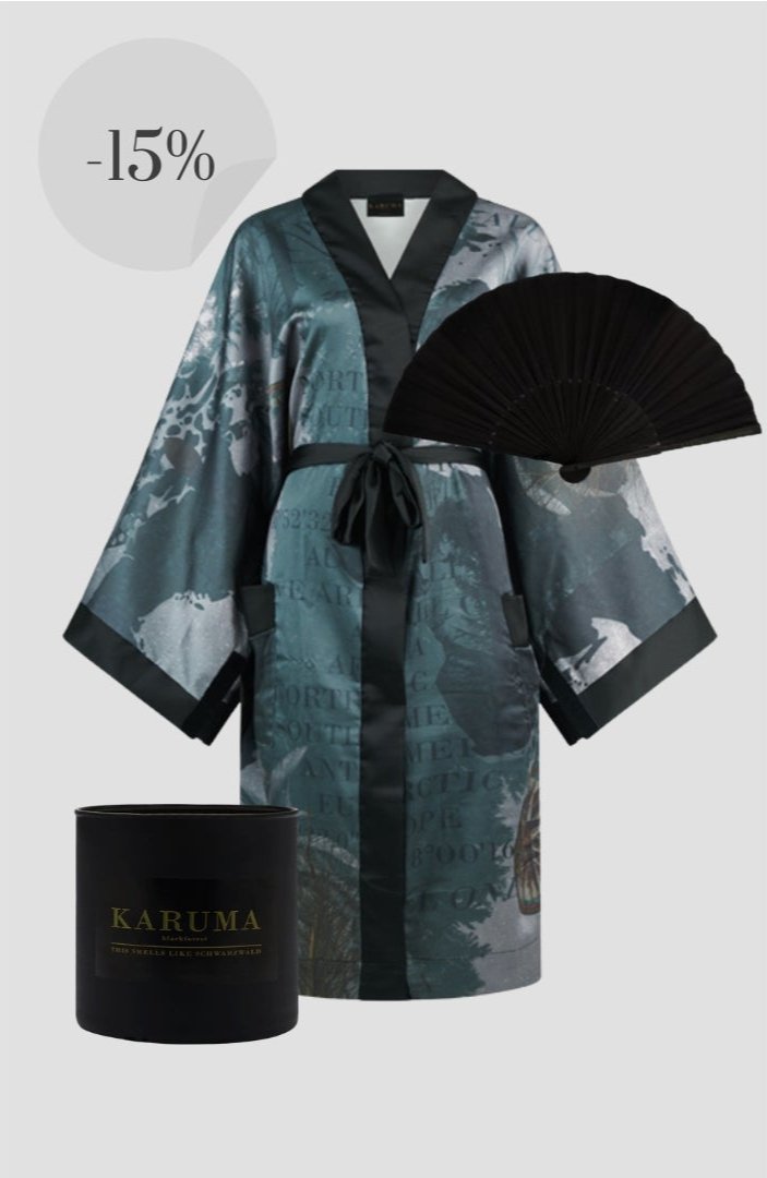 "Forest Green Harmony Kimono featuring a blend of green shades from moss to emerald, showcasing the essence of growth and nature with a modern cuckoo clock print that blends tradition and contemporary art."