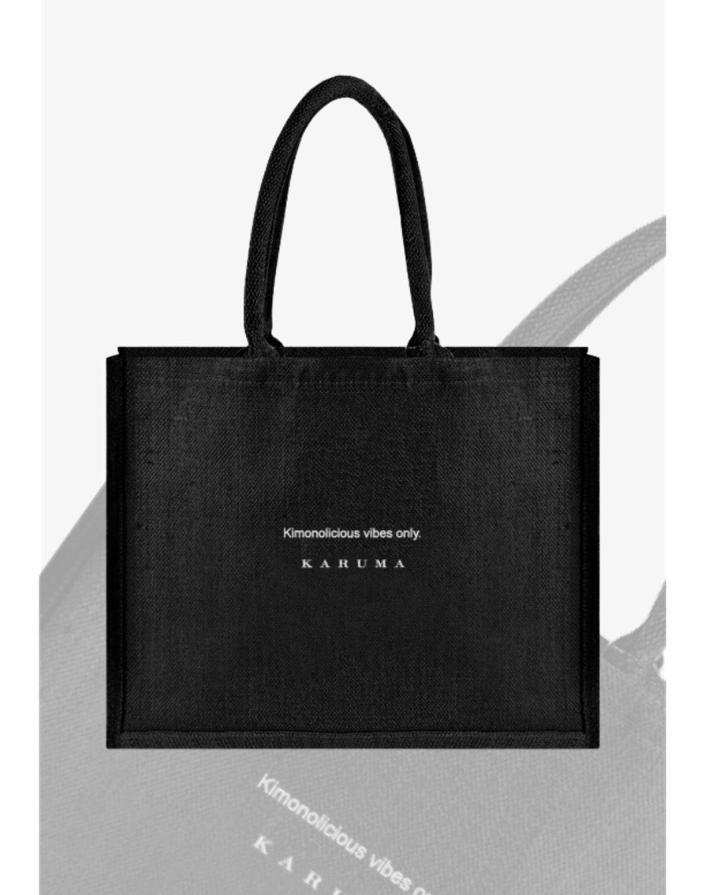 Handcrafted in Germany. Minimalist black. Two bold slogans, choose the one that speaks to you. The Karuma Statement Tote is designed for the woman who moves through life with intention and always looks effortless doing it