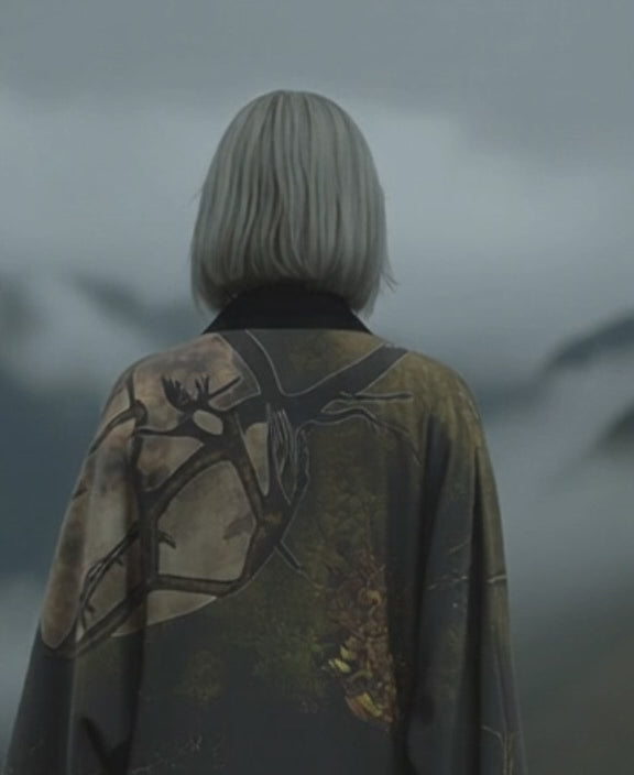Elegant statement kimono inspired by nature, featuring soft greens and warm tones of an afternoon in the woods